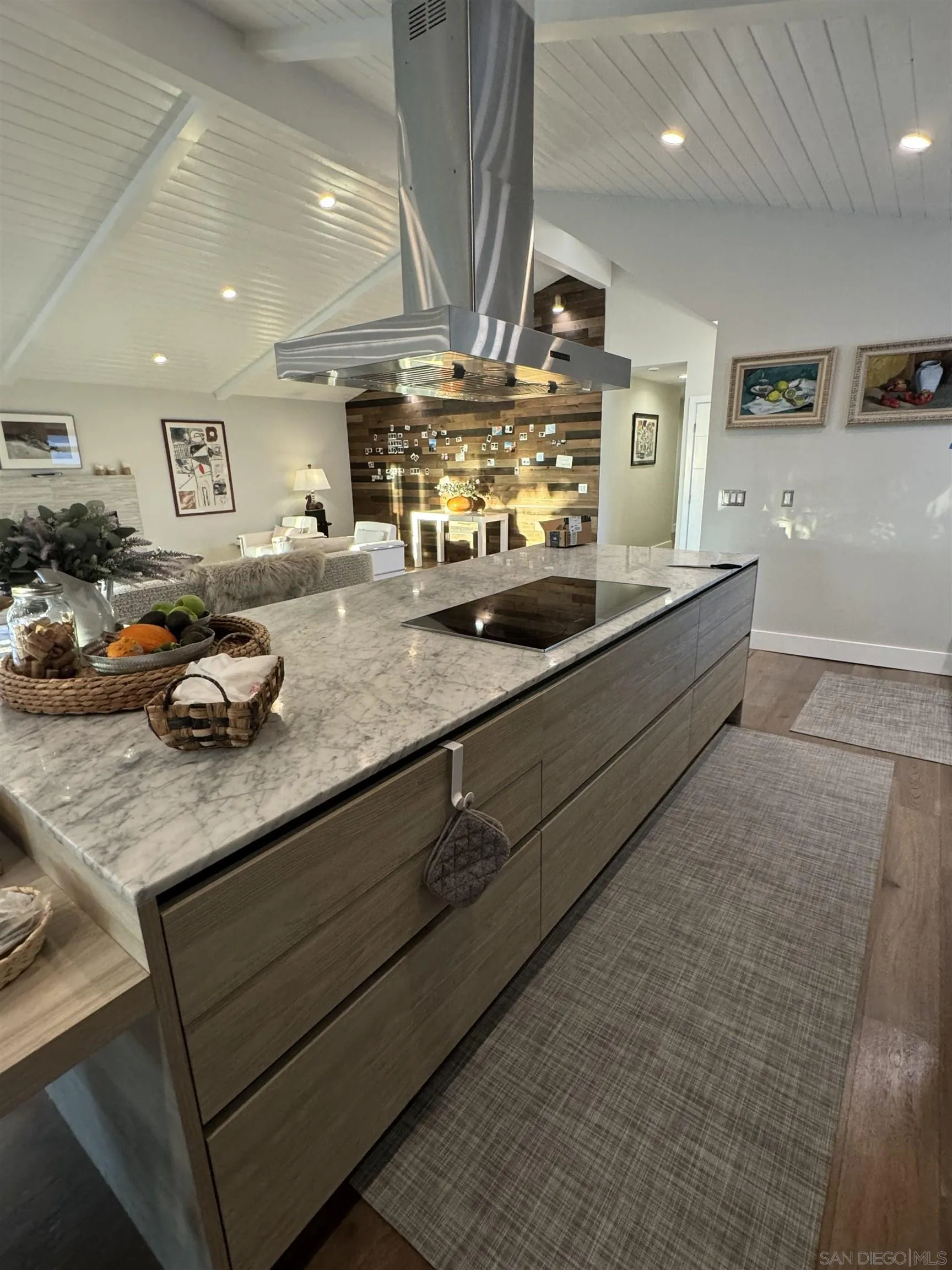 1402 Rodeo Drive La Jolla, CA 92037 - Photo 43 of 62 a kitchen with stainless steel appliances granite countertop a sink a stove and a granite counter top