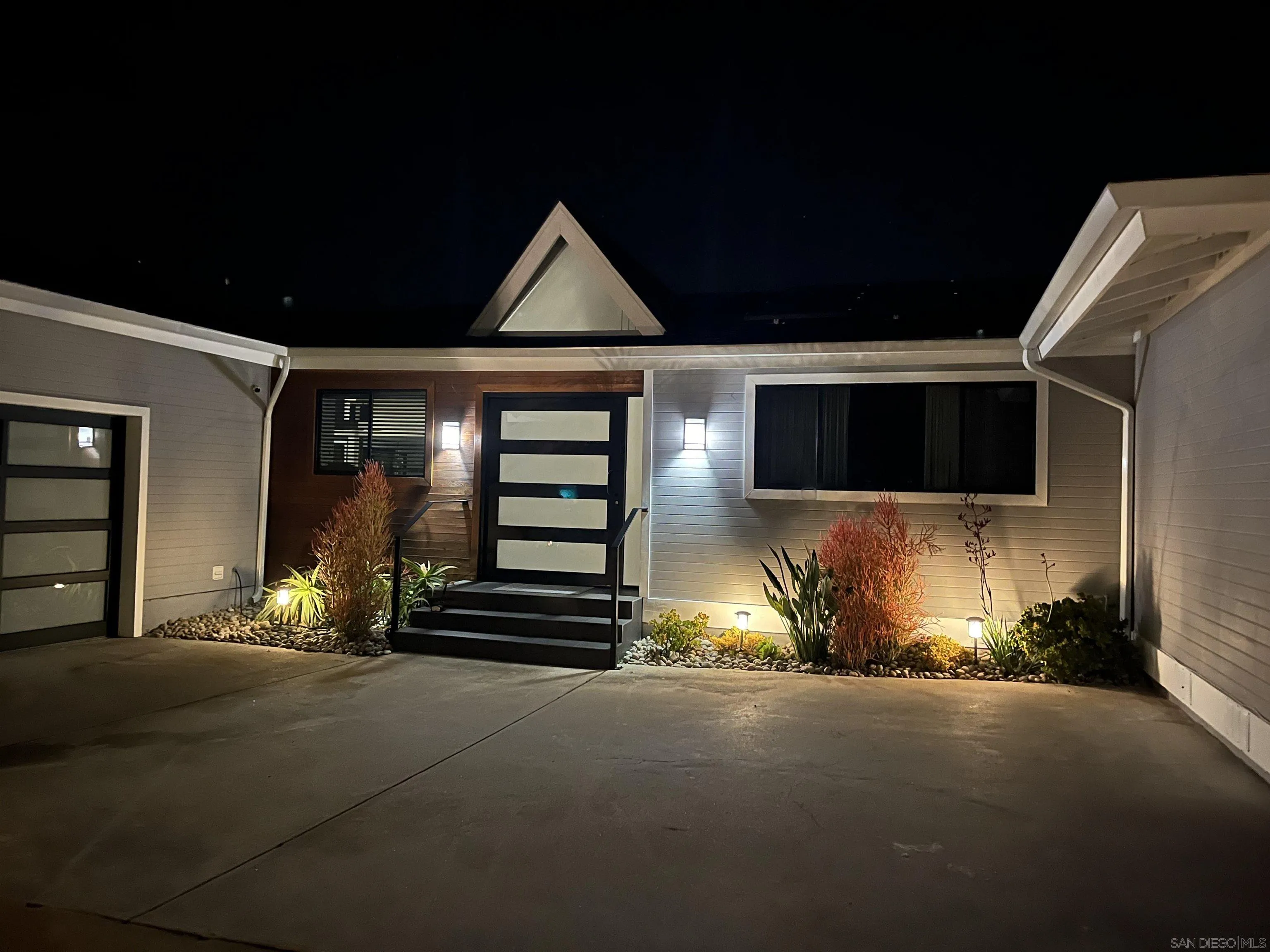 1402 Rodeo Drive La Jolla, CA 92037 - Photo 57 of 62 a front view of a house with a yard