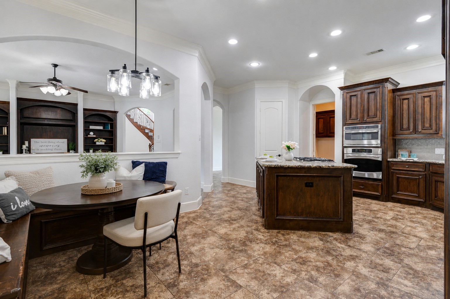 5327 Whitmore Fulshear, TX 77441 - Photo 8 of 50 The charming breakfast nook features built-in bench seating with hidden storage, creating a cozy space to enjoy morning coffee while overlooking the backyard. *This photo is virtually staged.