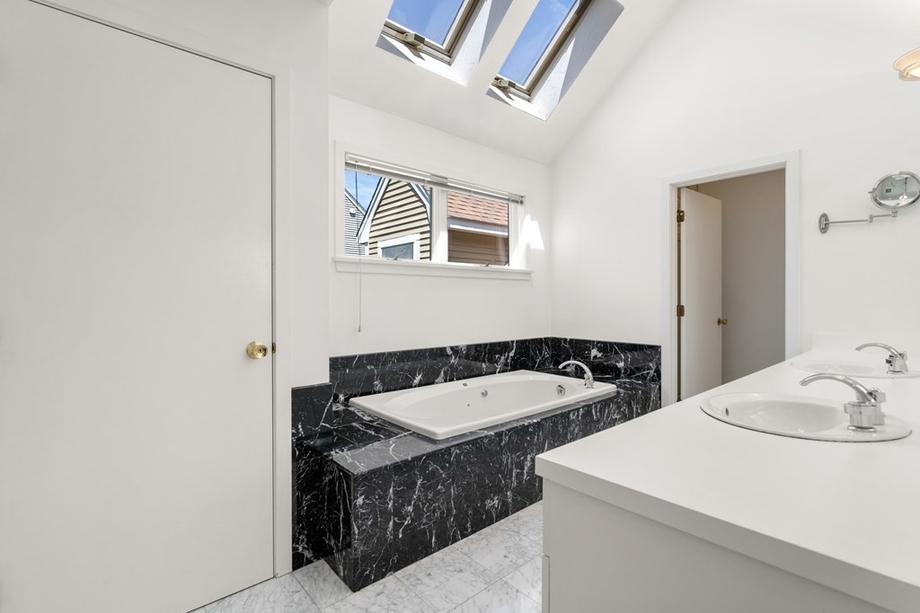 62 Lynn Road Needham, MA 02494 - Photo 12 of 24 a bathroom with a sink and a mirror