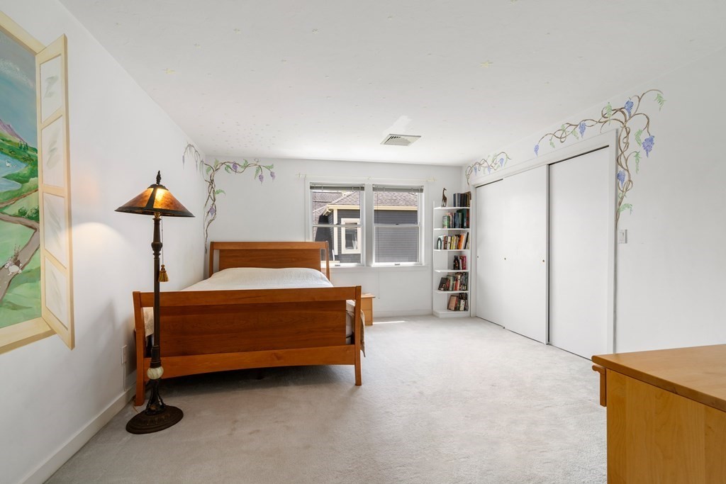 62 Lynn Road Needham, MA 02494 - Photo 14 of 24 a bedroom with a bed and a refrigerator