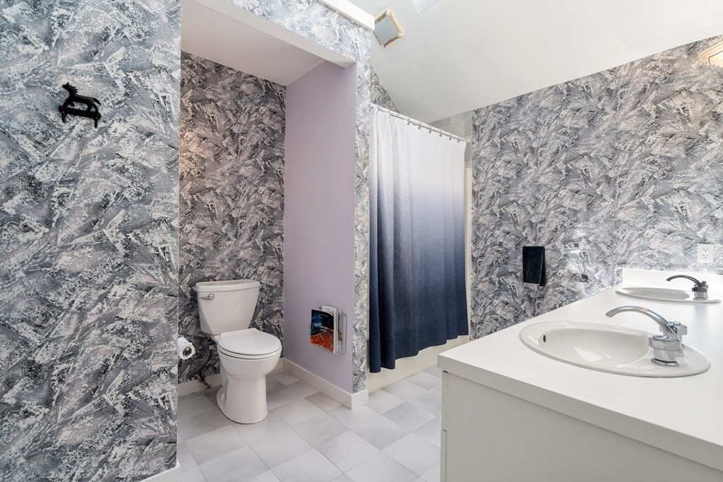 62 Lynn Road Needham, MA 02494 - Photo 16 of 24 a bathroom with a sink toilet and shower