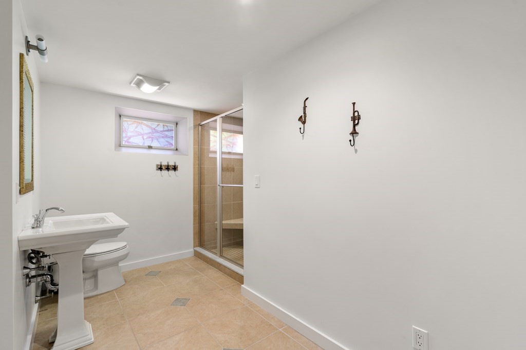 62 Lynn Road Needham, MA 02494 - Photo 18 of 24 a bathroom with a sink mirror and toilet
