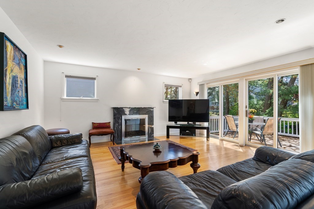 62 Lynn Road Needham, MA 02494 - Photo 5 of 24 a living room with furniture and a flat screen tv with wooden floor