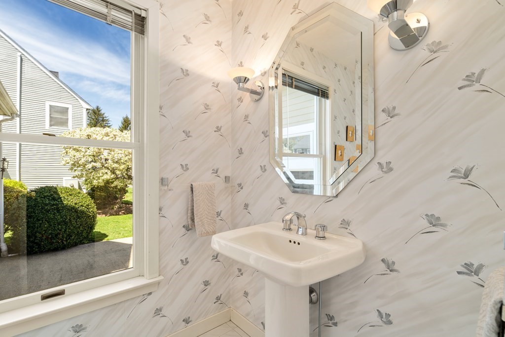 62 Lynn Road Needham, MA 02494 - Photo 6 of 24 a bathroom with a sink a mirror and a shower