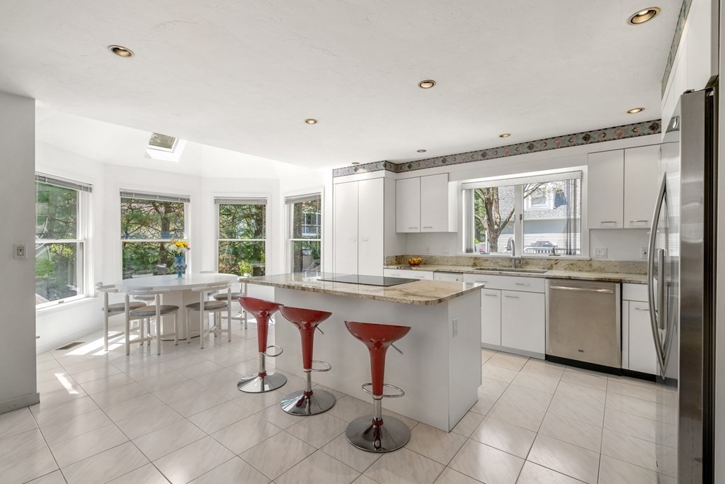 62 Lynn Road Needham, MA 02494 - Photo 8 of 24 a kitchen with counter top space and dining table