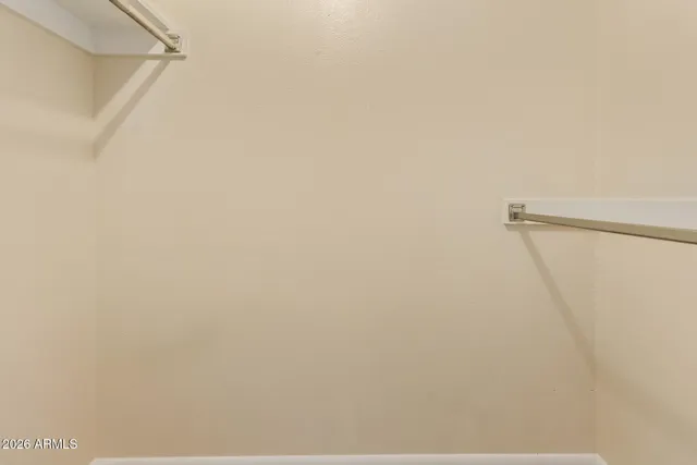 a bathroom with a toilet a sink and a mirror