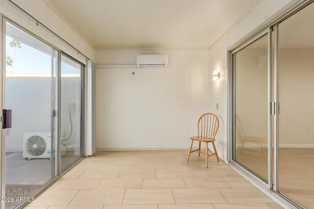 a view of a room with a glass door