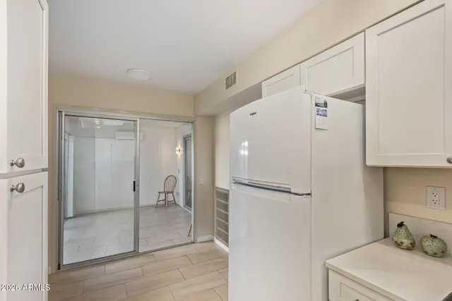 a bathroom with a shower and a sink