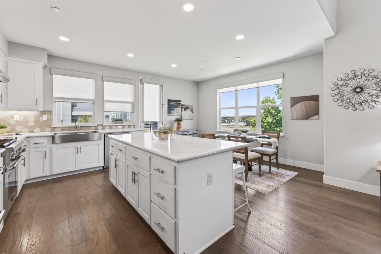 202 Market Street Milpitas, CA 95035 - Photo 3 of 30 a kitchen with a sink stove cabinets and wooden floor