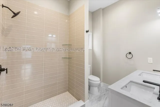 a bathroom with a toilet a sink and a bathtub