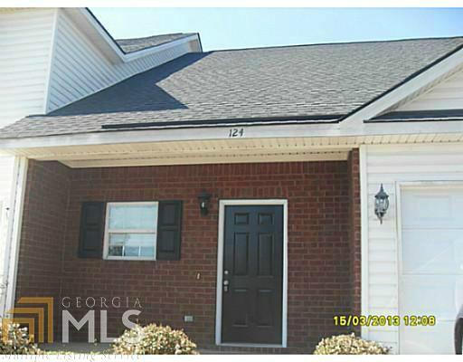116 Barfield Way, Unit 9 Rincon, GA 31326 - Photo 1 of 1 a front view of a building with a garden