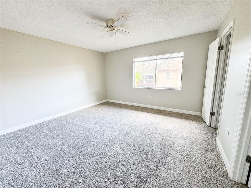2732C Hidden Lake Boulevard, Unit D Sarasota, FL 34237 - Photo 12 of 19 an empty room with a window