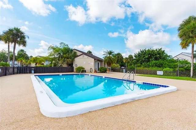 a view of a swimming pool with a yard