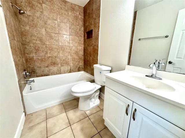 a bathroom with a sink a toilet and a bathtub