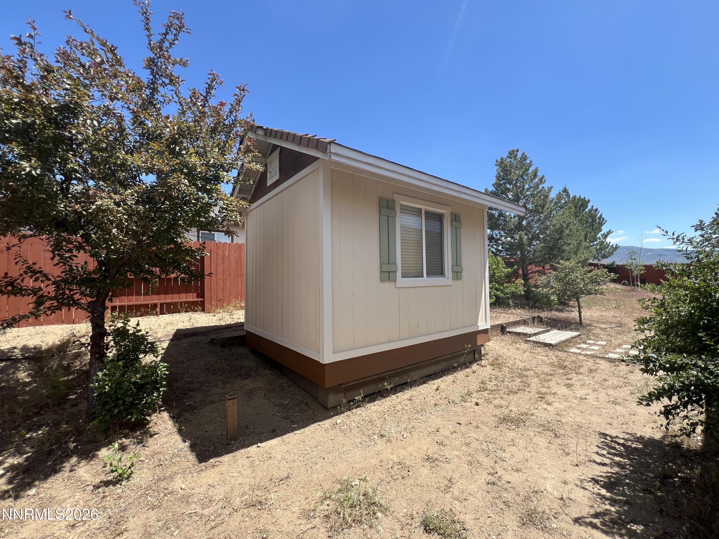 18406 Teddy Bear Court Reno, NV 89508 - Photo 41 of 44 a view of a house with a yard covered with snow in the background