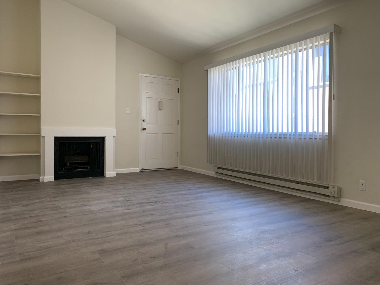 729 Highland Avenue, Unit 3 San Mateo, CA 94401 - Photo 5 of 18 an empty room with windows