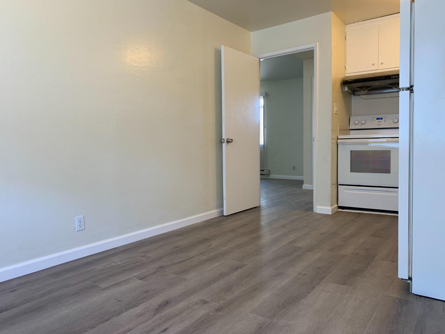 729 Highland Avenue, Unit 3 San Mateo, CA 94401 - Photo 10 of 18 a view of empty room with wooden floor