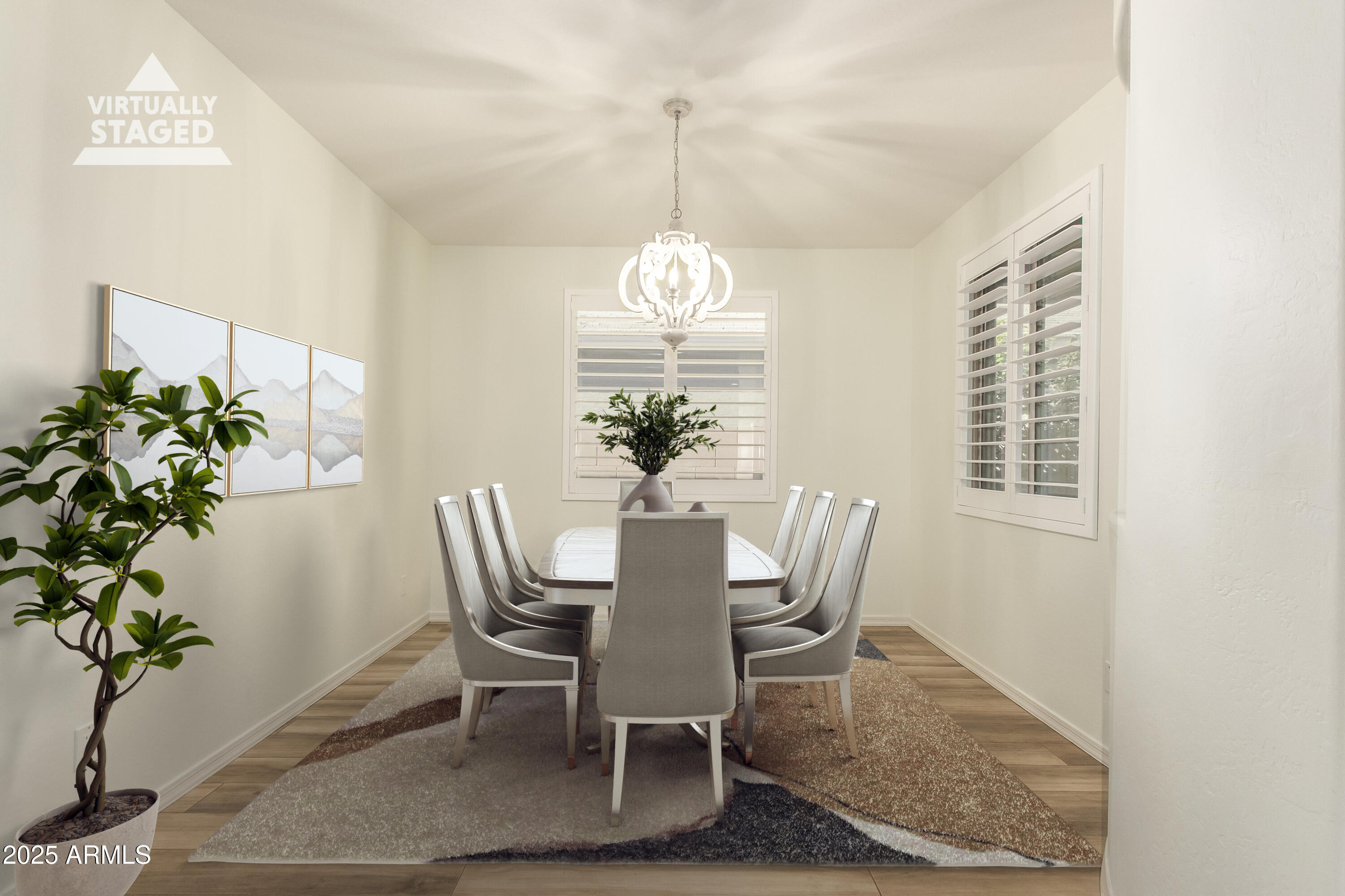 5660 South Colt Mesa, AZ 85212 - Photo 13 of 34 a dining room with furniture potted plants and wooden floor