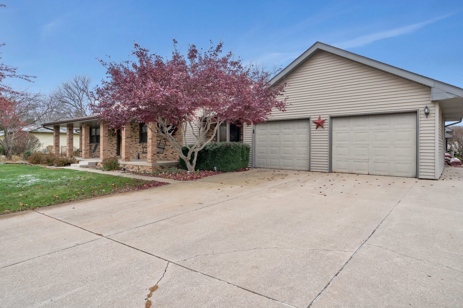 308 San Carlos Road Minooka, IL 60447 - Photo 2 of 25 a front view of a house with a yard and garage