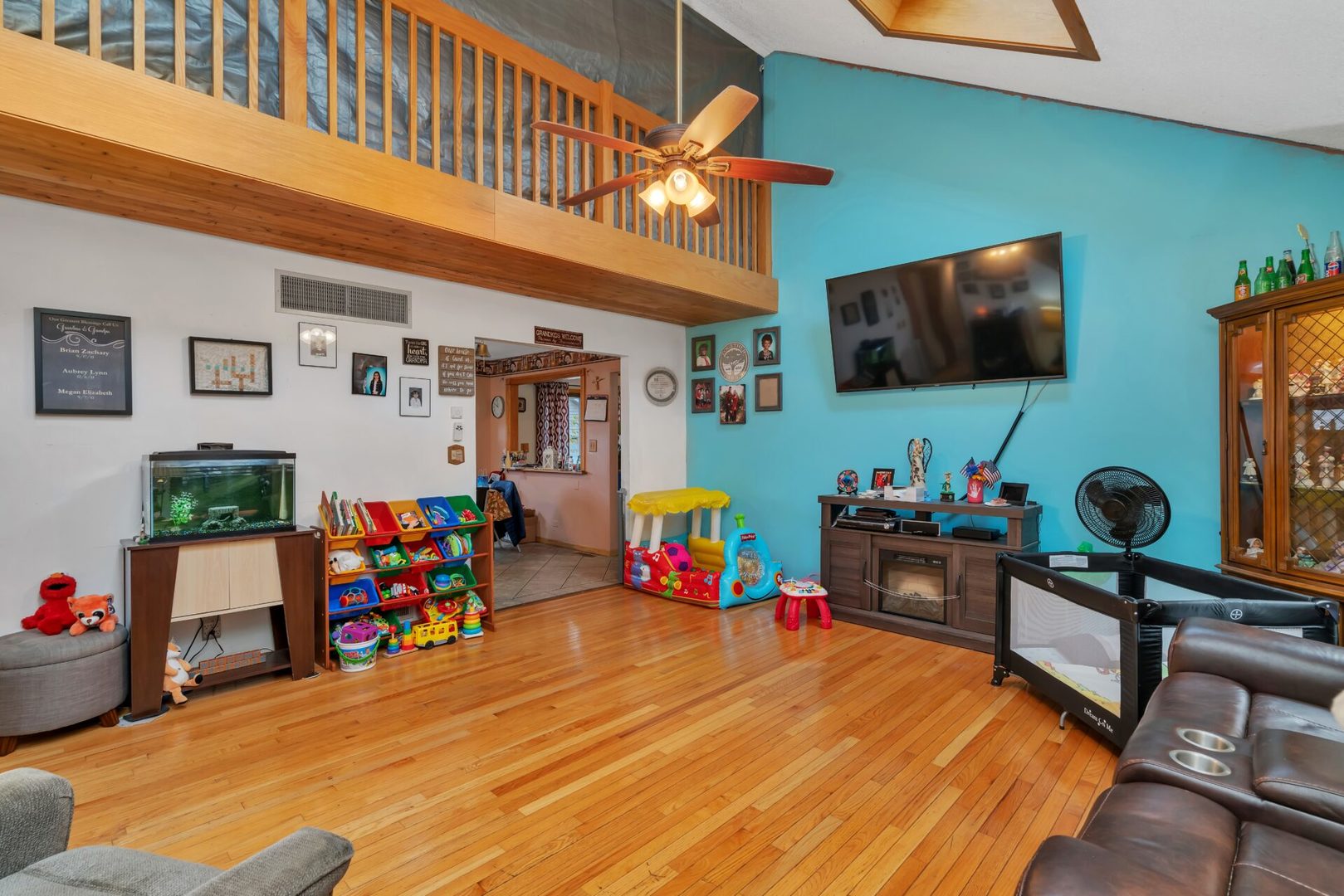 308 San Carlos Road Minooka, IL 60447 - Photo 3 of 25 a room with furniture and a flat screen tv