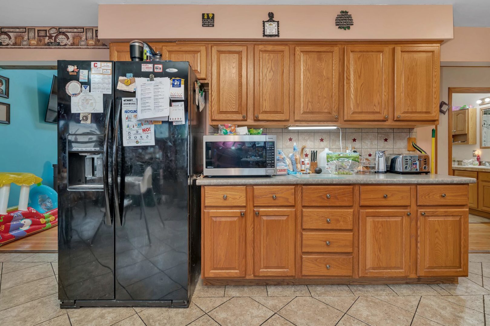 308 San Carlos Road Minooka, IL 60447 - Photo 7 of 25 a kitchen with stainless steel appliances granite countertop a refrigerator and cabinets