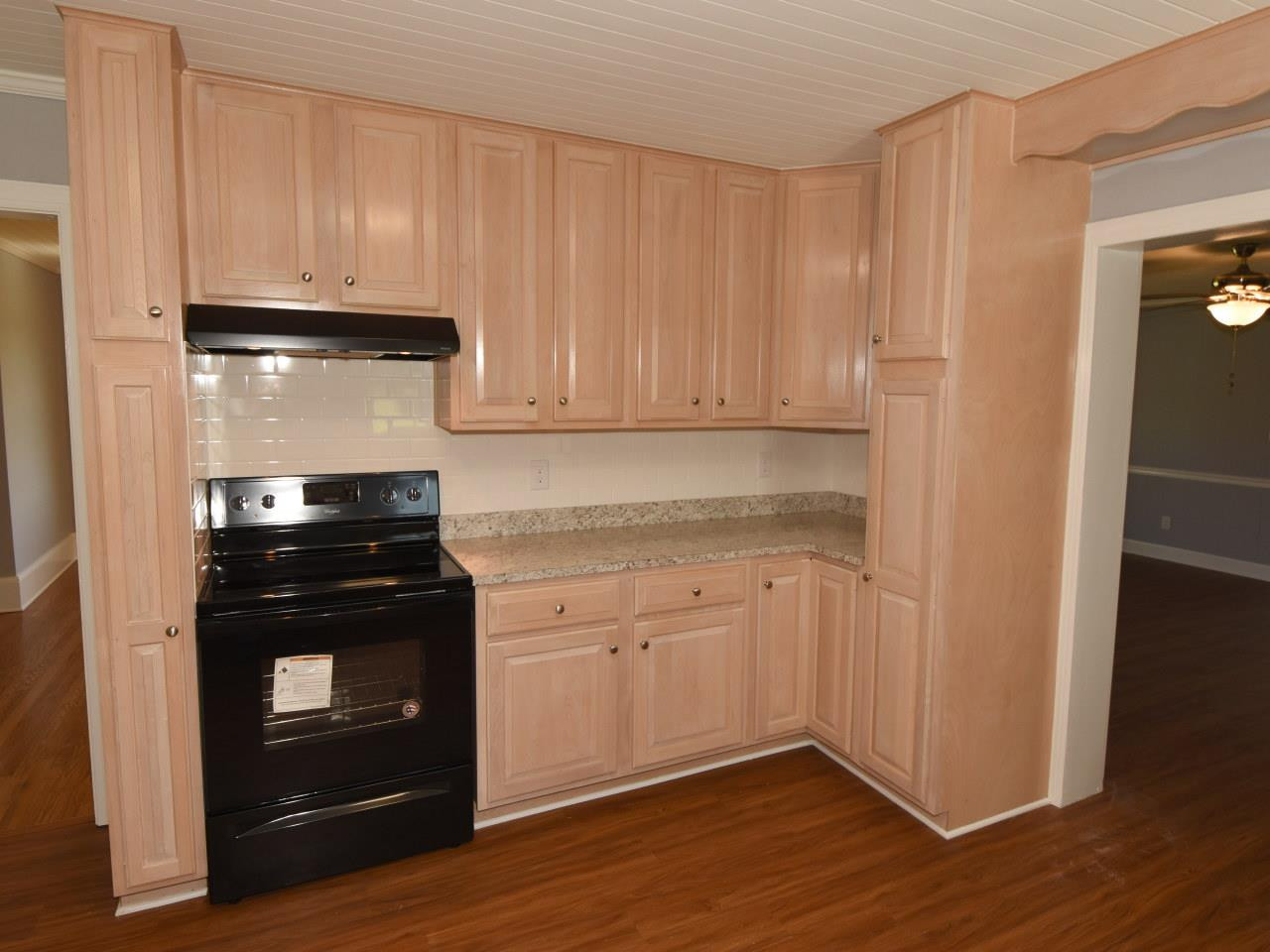 1525 Micro Road Selma, NC 27576 - Photo 10 of 25 New stove, vent hood, new countertops, beadboard ceiling kitchen
