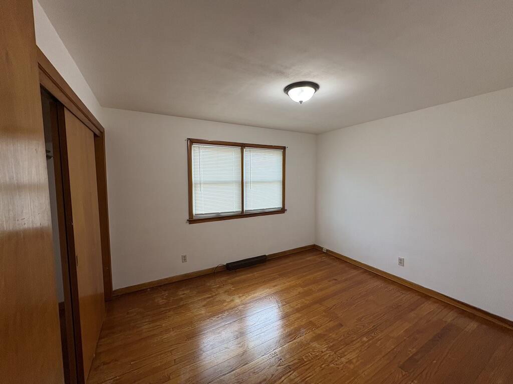 1915 169th Street Hammond, IN 46324 - Photo 14 of 19 an empty room with wooden floor and windows