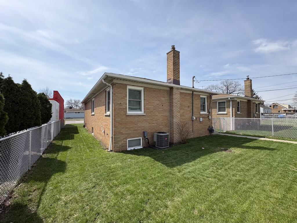 1915 169th Street Hammond, IN 46324 - Photo 4 of 19 a front view of a house with garden