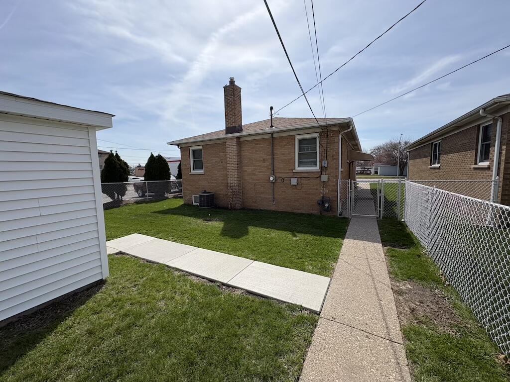 1915 169th Street Hammond, IN 46324 - Photo 5 of 19 a view of a house with a yard