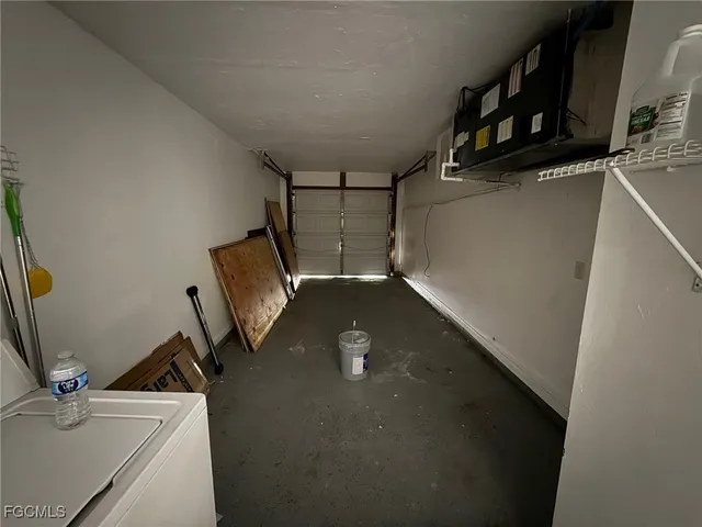 a view of storage and utility room with racks on the wall