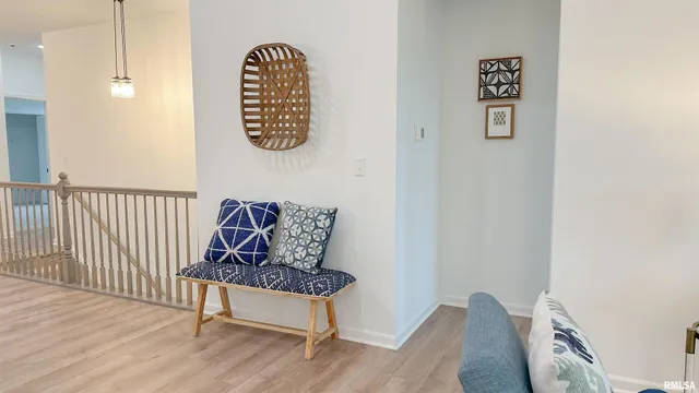 a bench sitting next to a wooden floor