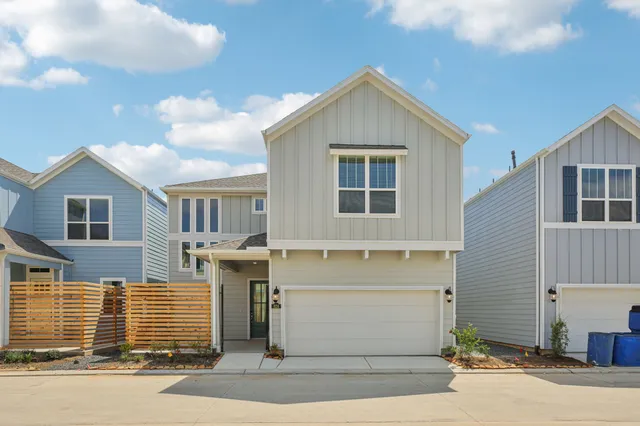 a front view of a house with a garage
