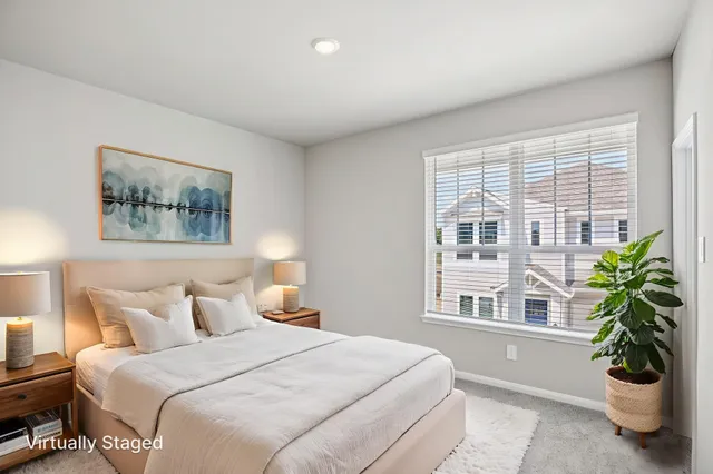 an empty room with a bathroom and a shower