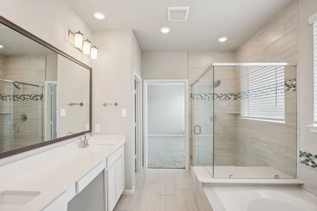 a bathroom with a sink mirror and toilet