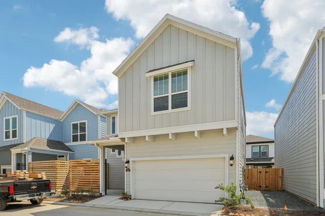 a front view of a house with a garage