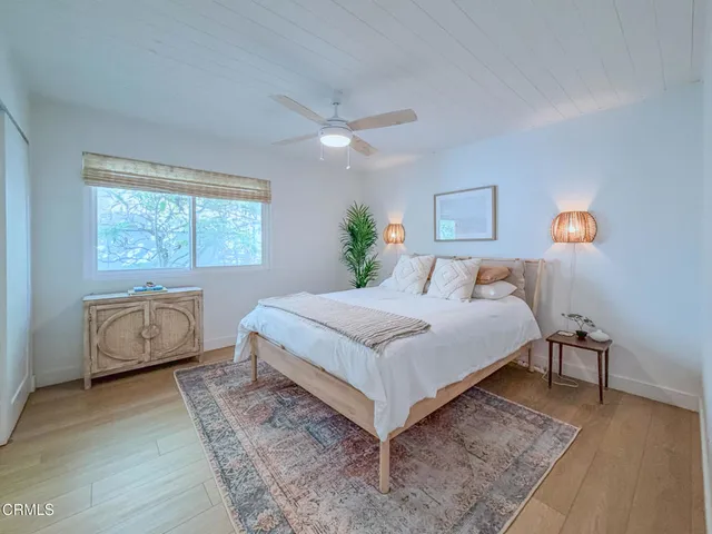 a bedroom with a bed and a table