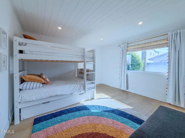 a view of bedroom with furniture and window
