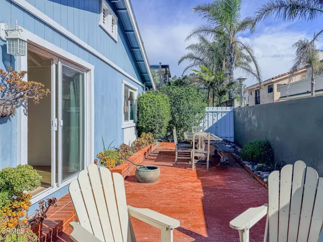 a outdoor space with patio the couches and a dining table with chairs