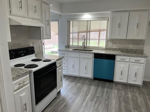 1022 Misty Way Garland, TX 75040 - Photo 2 of 15 a kitchen with granite countertop cabinets stainless steel appliances and a wooden floor