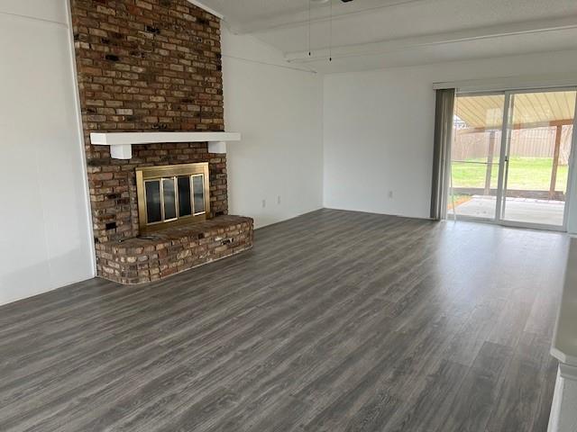 1022 Misty Way Garland, TX 75040 - Photo 7 of 15 an empty room with wooden floor fireplace and windows