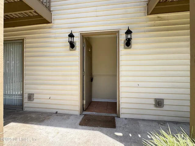 a view of porch with wooden floor