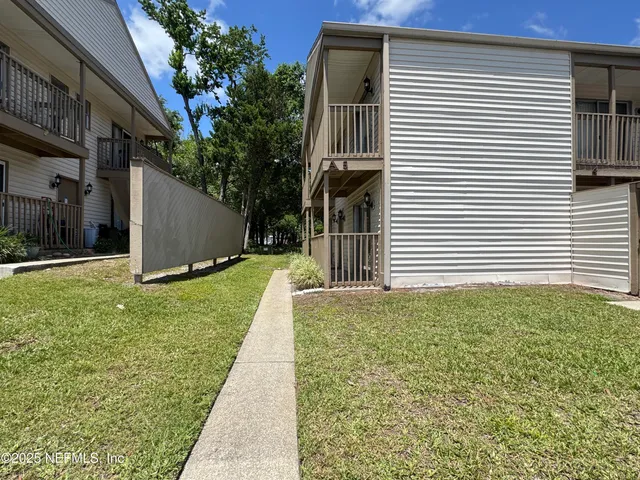 a kitchen with granite countertop a sink and a stove