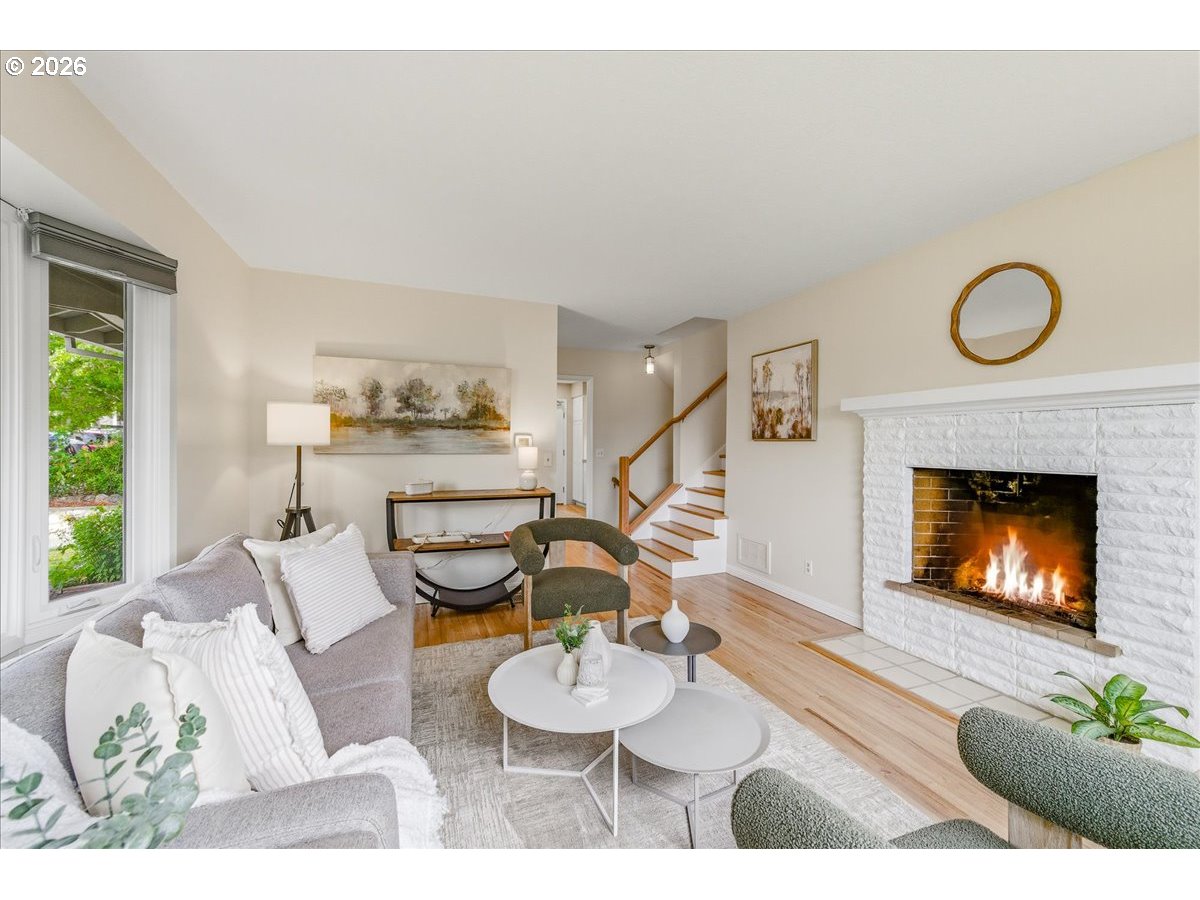 3130 Southwest 116th Avenue Beaverton, OR 97005 - Photo 20 of 44 a living room with furniture and a fireplace