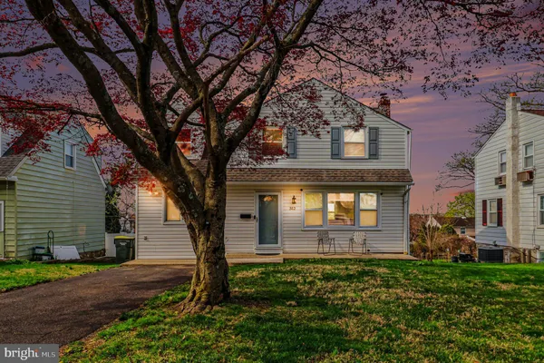 front view of a house with a tree