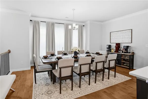 a kitchen with a table and chairs in it