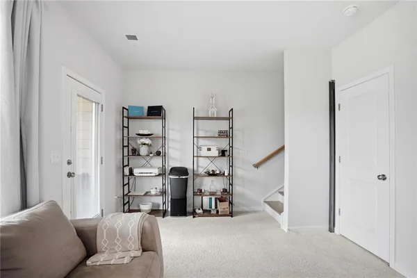 a living room with furniture and a window