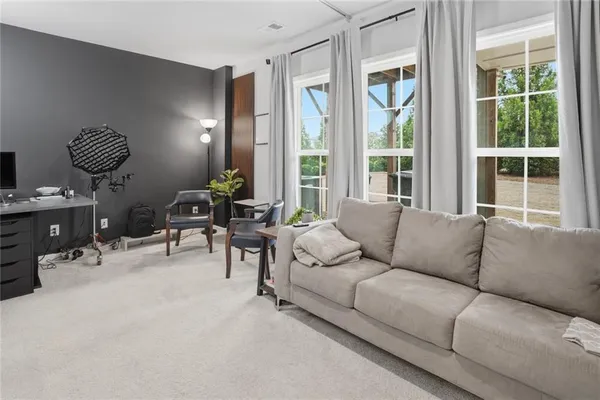 a bathroom with a sink a toilet a mirror a bathtub and shower