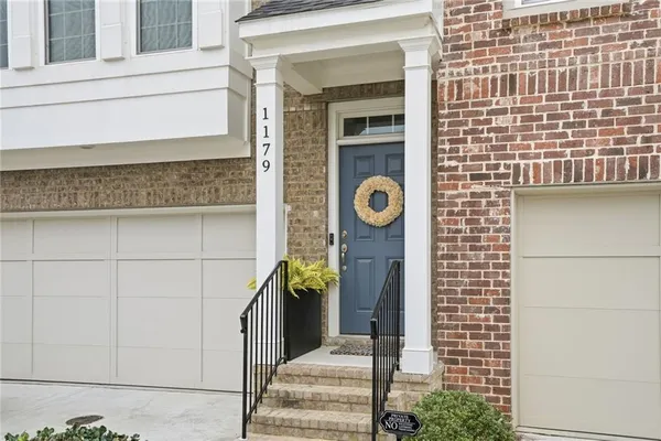 a front view of a house with a shower and a sink