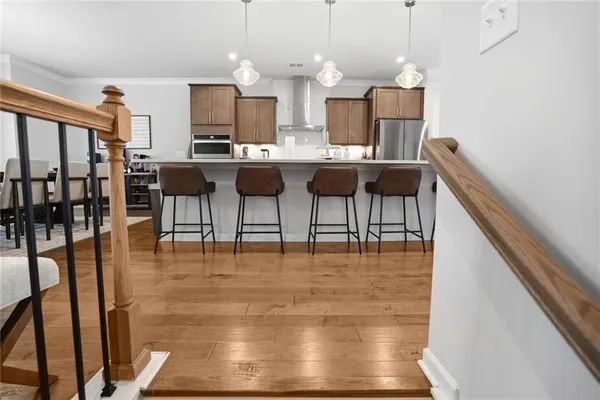 a kitchen with a dining table and chairs